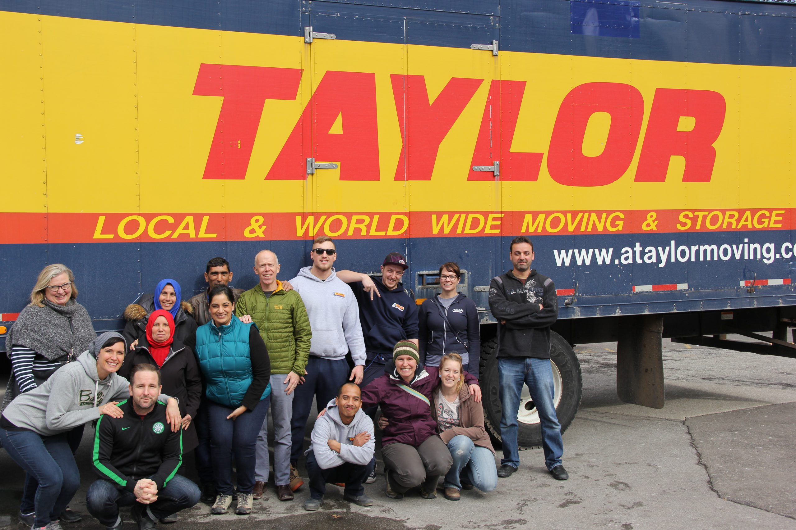 Taylor Moving staff next to a moving truck