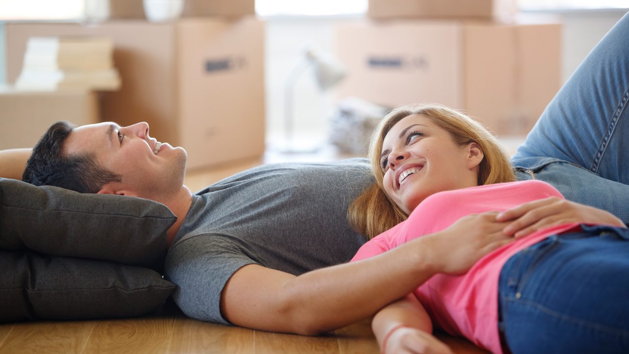 New home owners with Taylor Moving boxes