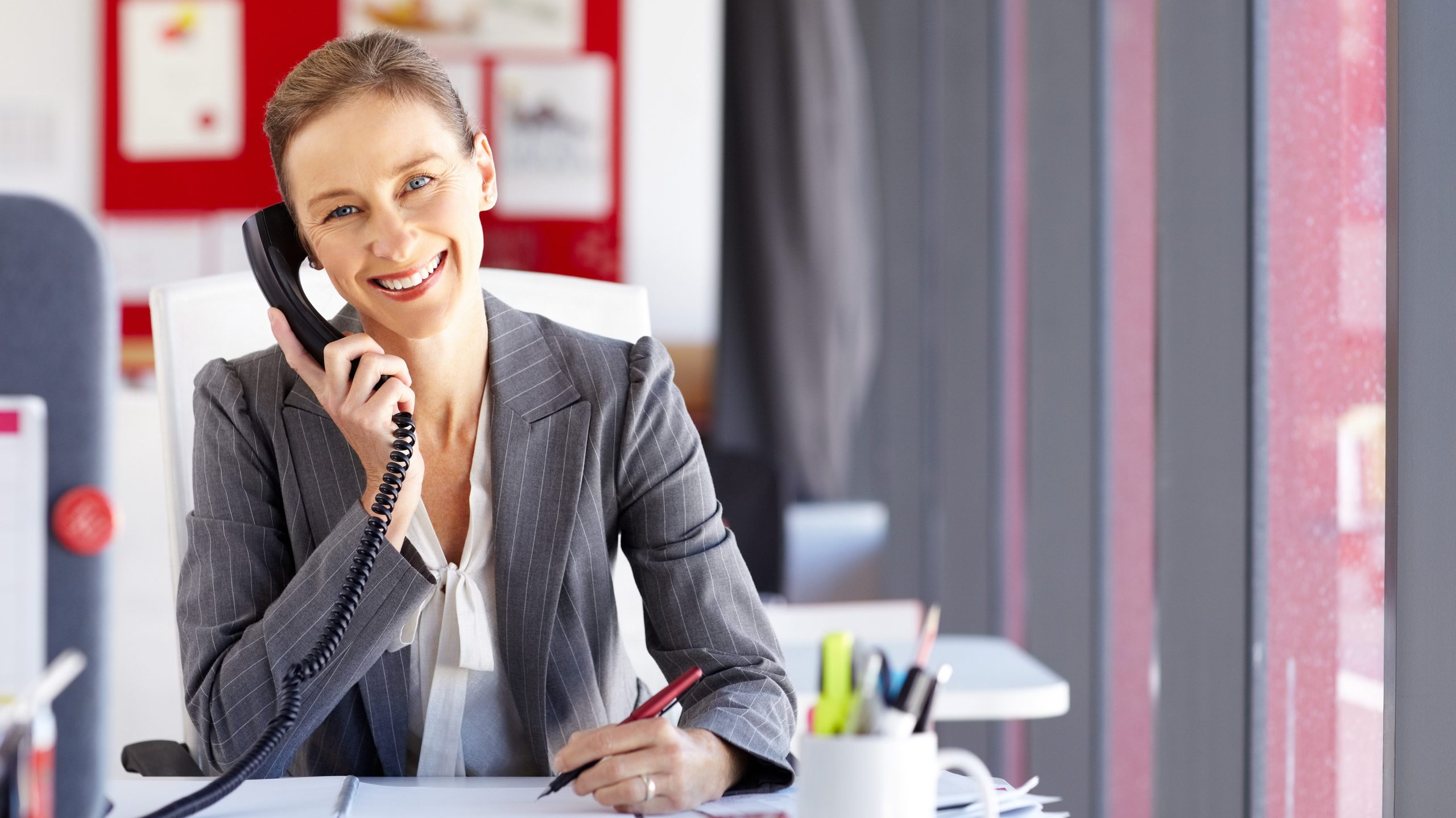 Woman on the phone at a desk